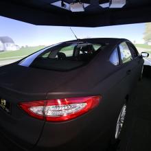 The new driving simulator lab includes this full-size Ford Fusion and two smaller desktop simulators that can interact in the simulated environment. 
