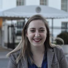 ISyE undergraduate Lois Johnson, here in front of the White House's West Wing