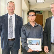 ISyE School Chair Edwin Romeijn and Associate Chair for Graduate Studies Alan Erera with Ph.D. student Simon Mak, recipient of the Alice and John Jarvis, Ph.D. Student Research Award 