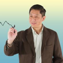 Associate Professor Shijie Deng illustrates a financial model incorporating Brownian motion.